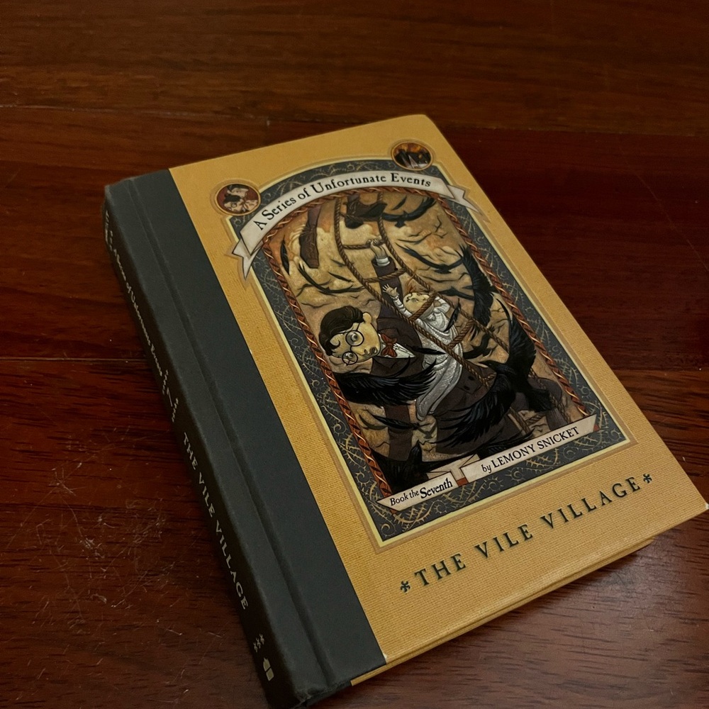 The Vile Village Hardcover - Yellow and Black
